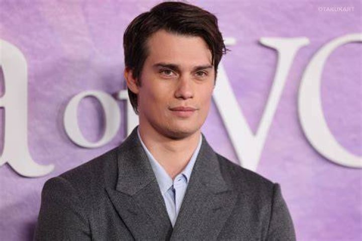 Nicholas Galitzine's character Luke in army uniform kissing Sofia Carson's character Cassie